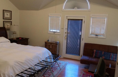 Wellesley House | Inviting Master Bedroom with Elegant Bath Retreat