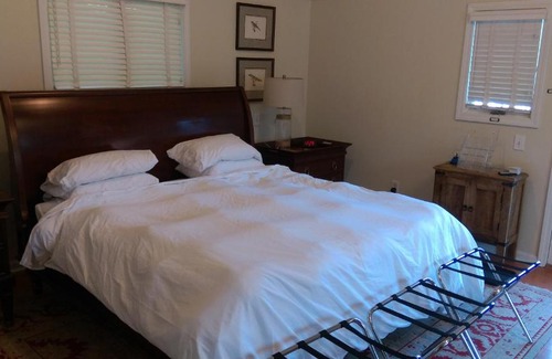 Wellesley House | Inviting Master Bedroom with Elegant Bath Retreat