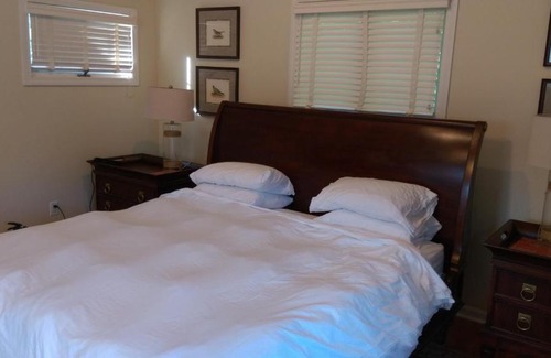 Wellesley House | Inviting Master Bedroom with Elegant Bath Retreat