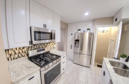 Whitehall House | Modern 4-Bedroom Retreat with Upscale Backyard & Spa