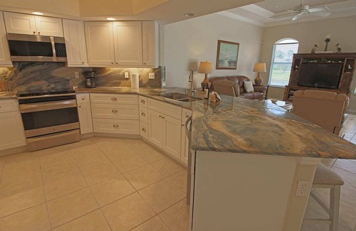 Long Meadow House | Relaxing Pool with Scenic Canal Views and Family-Friendly Amenities
