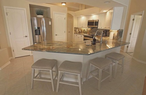 Long Meadow House | Relaxing Pool with Scenic Canal Views and Family-Friendly Amenities