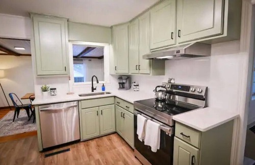 Covington House | Welcoming Town Square Theatre Room: 4 Bed, 2 Bath Home