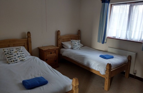 Holsworthy House | Spacious two-bedroomed fully-accessible lodge with lake view in rural idyll