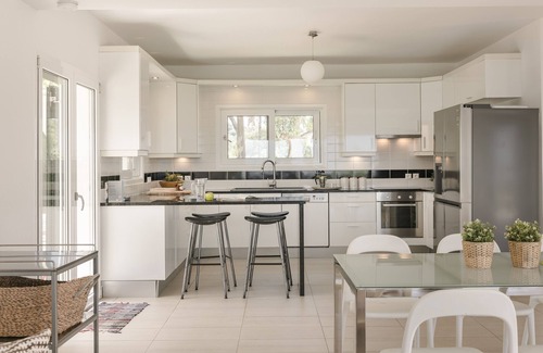 Leivathos Villa | Inviting Villa with Ocean Views, Pool & Tennis Court