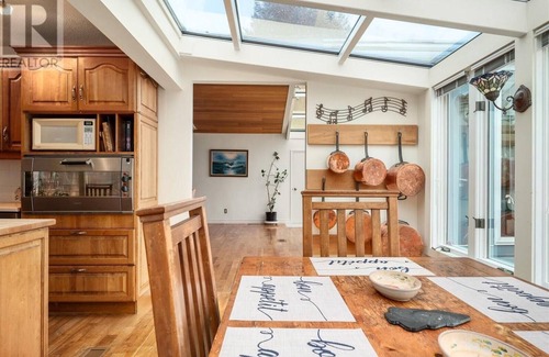 Regional District of Nanaimo House | Inviting Blue Dolphin Walk-on Waterfront with Ocean View
