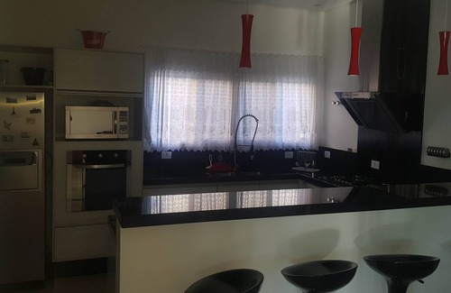 Itu House | Elegant 4-Suite Condo with Pool and Pet-Friendly Amenities