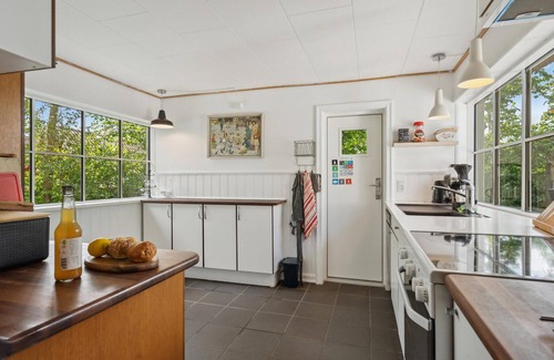Vejlby Fed House | Relax in a Cozy Cottage with Breathtaking Ocean Views