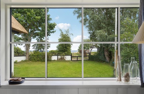 Vejlby Fed House | Relax in a Cozy Cottage with Breathtaking Ocean Views