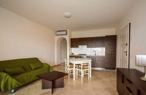 Porto Pozzo Apartment | Inviting Seaview Apartment with Pool and Pet-Friendly Options