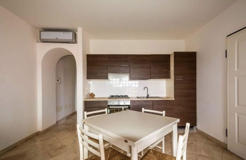 Porto Pozzo Apartment | Inviting Seaview Apartment with Pool and Pet-Friendly Options