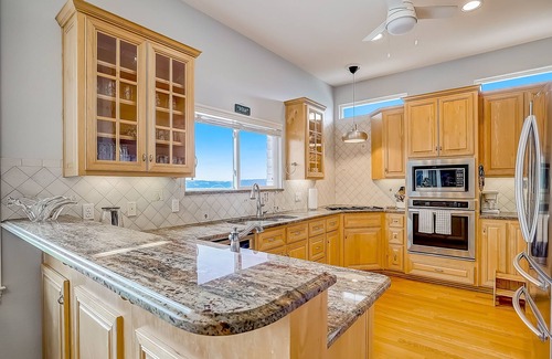 Travis Landing House | Sprawling private home with a large yard, water views, in-home gym, W/D, & AC