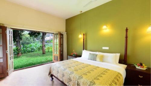 Thekkady Resort | Cozy Springdale Heritage: Oceanfront Escape with Pool