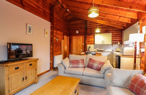 Marybank Cottage | Pet-Friendly Spruce Lodge with Garden in Strathpeffer