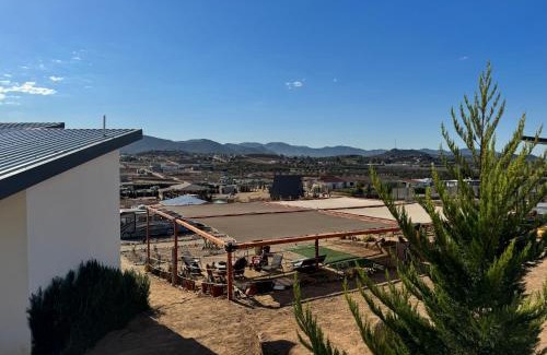 Valle de Guadalupe Bed & Breakfast | Inviting Cabin Retreat with Balcony in Villa Loar