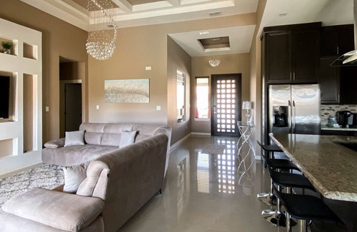 Brownsville House | Elegant Retreat with Pool, Modern Kitchen & Inviting Patio