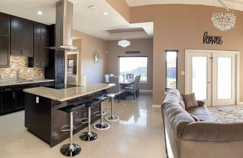 Brownsville House | Elegant Retreat with Pool, Modern Kitchen & Inviting Patio
