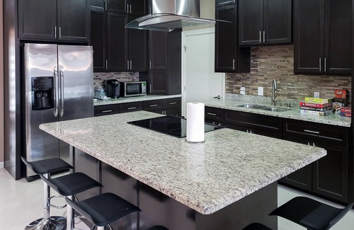 Brownsville House | Elegant Retreat with Pool, Modern Kitchen & Inviting Patio