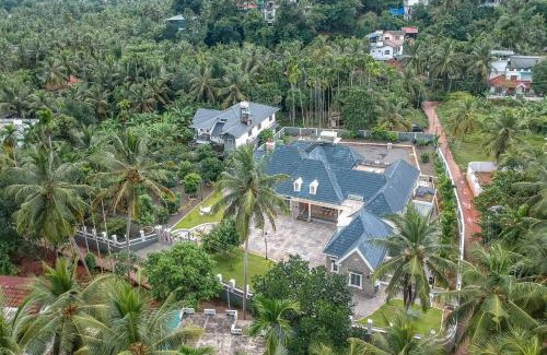 Kozhikode Villa | Unforgettable StayVista at The Stone Villa with Court & Pool