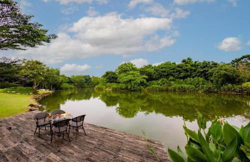 Indore Villa | Relax at Water Song Garden: Lake-Side Villa with Games