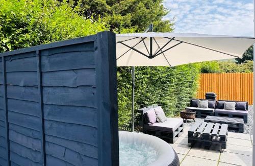 Port Talbot House | Steel Town Lodge: Cozy Retreat with Hot Tub & Ocean View