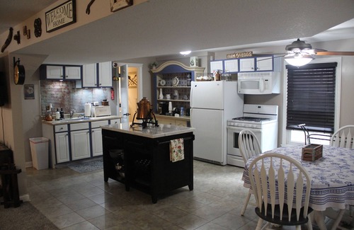 Eudora House | Step Back In Time to a charming 2-bedroom lower level house in adorable Eudora