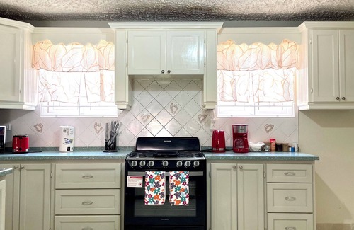 Graeme Hall Terrace House | Ideal Family Getaway: Steps 2 Beach with Spa & Hot Tub