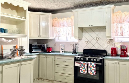 Graeme Hall Terrace House | Ideal Family Getaway: Steps 2 Beach with Spa & Hot Tub