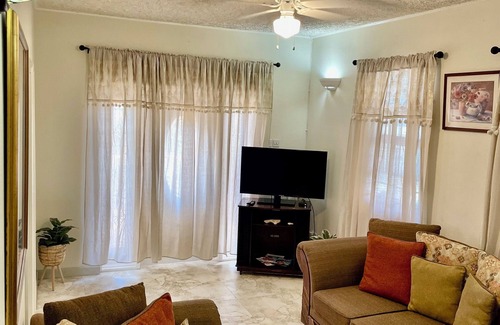Graeme Hall Terrace House | Ideal Family Getaway: Steps 2 Beach with Spa & Hot Tub