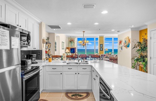 Thomas Drive Condo | Sterling Beach 1007 Huge 4BR/4BA Corner Unit! Heated Pool, Grills & FREE Golf