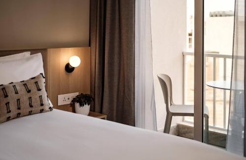 Gzira Hotel | Oceanfront Strand Suites by NEU Collective - Rated 8.7/10