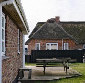 Fjand Badeby House | Discover Strandfogedgården: Pet-Friendly with Hot Tub Access