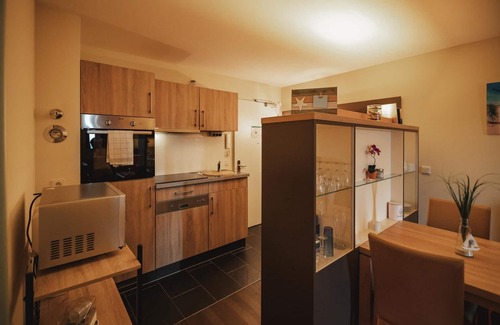 Wremen Apartment | Cozy Oceanfront Retreat with Sauna and Balcony Views