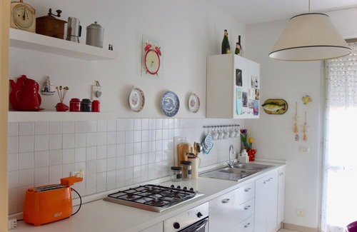 Forte dei Marmi Apartment | Ideal Oceanfront Attic with Balcony, Steps from the Sea