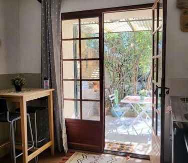 Notre-Dame-Limite Apartment | Charming Independent Studio with Garden Terrace & Ocean View