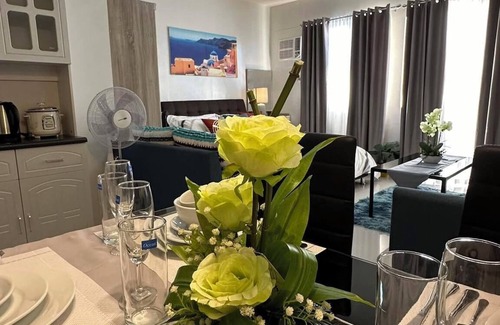 Puerto Princesa City Centre Condo | Studio 1queen Bed, sofa, kitchen and Balcony Puerto Princesa, Palawan