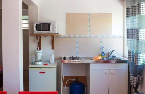 La Colline Apartment | Cozy Studio with Ocean View in Schoelcher - Family Friendly