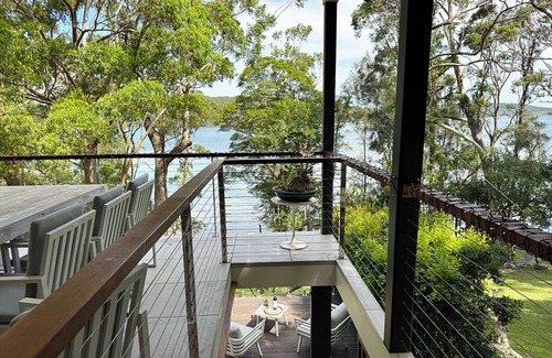 Smiths Lake House | Stunning lakefront retreat on Smiths Lake. Swim, boat, & fish from the backyard!