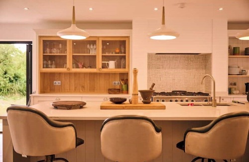 Norwich House | Modern River Retreat with Spa and Hot Tub Amenities