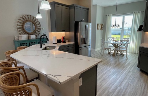 Sumter County House | Stunning new home with water view, screened lanai & golf cart!