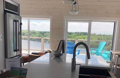 Grand-Etang House | Beautiful Nordic Cottage on Lake with Ocean Views & Breakfast