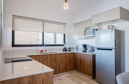 Telchac Puerto Apartment | Stunning oceanfront retreat with a pool and great views, perfect for families