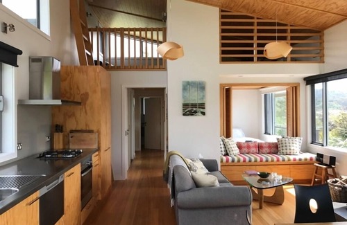 Parapara House | Serene Estuary-Front Retreat with Spa and Ocean Views
