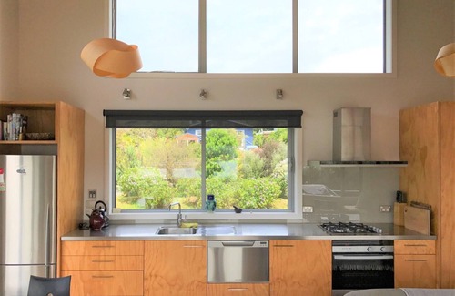 Parapara House | Serene Estuary-Front Retreat with Spa and Ocean Views