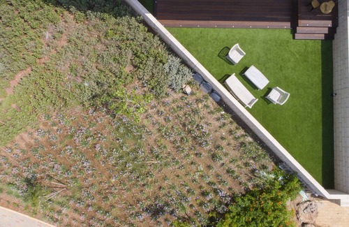 Nahariya Apartment | Modern Garden Retreat Steps from Akhziv Beach