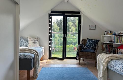 Vadstena Villa | Elegant Lake View House with Hot Tub & Family-Friendly Perks