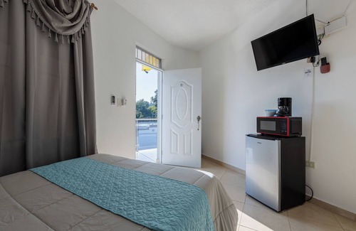Samana Hotel | Stylish City Loft with Hot Tub and Wi-Fi Access