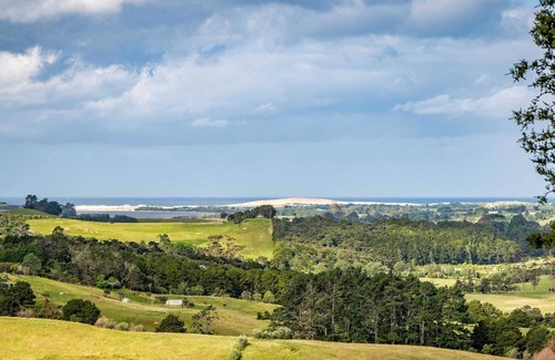 Mangawhai Villa | Stylish Space with a Green Rural outlook peaking to the Mangawhai Sand Dunes and