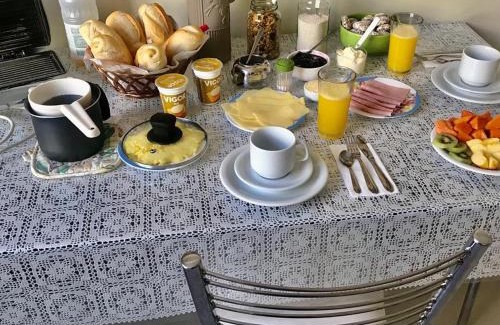Auxiliadora House | Comfortable Suites on Avenida Carlos Gomes with Kitchen Access