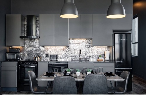 West Main Historic District Condo | Elegant City Loft Escape with River Views & Great Amenities